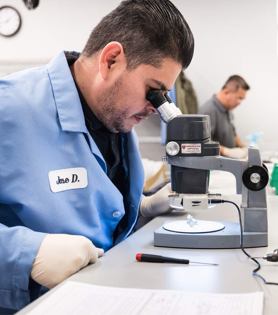 A man looking through a microscope